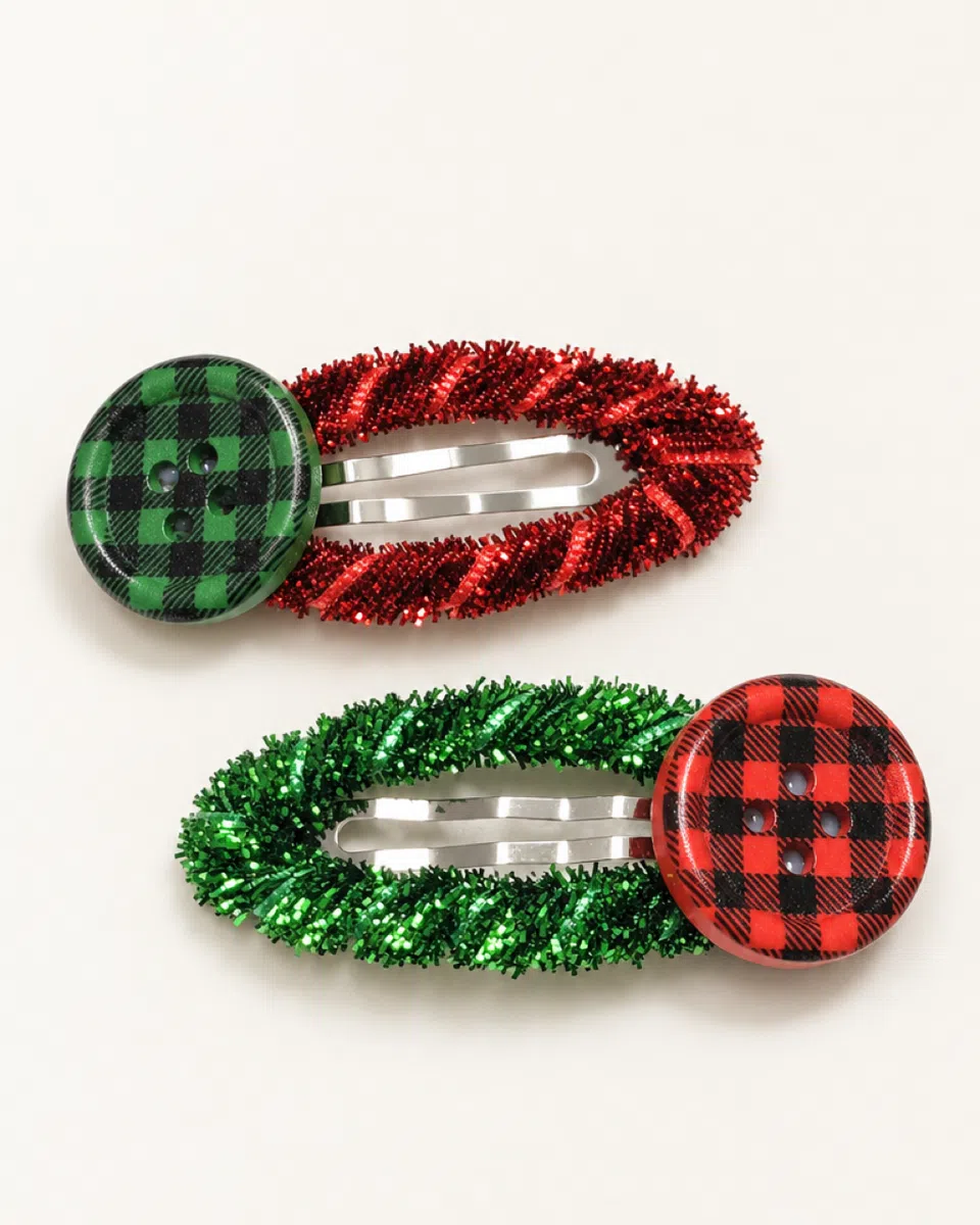 The Christmas tinsel clips on a white background: red tinsel with a green check button, and green tinsel with a red one